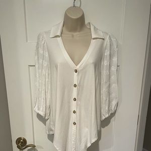 Anthropologie white blouse with tie at the bottom